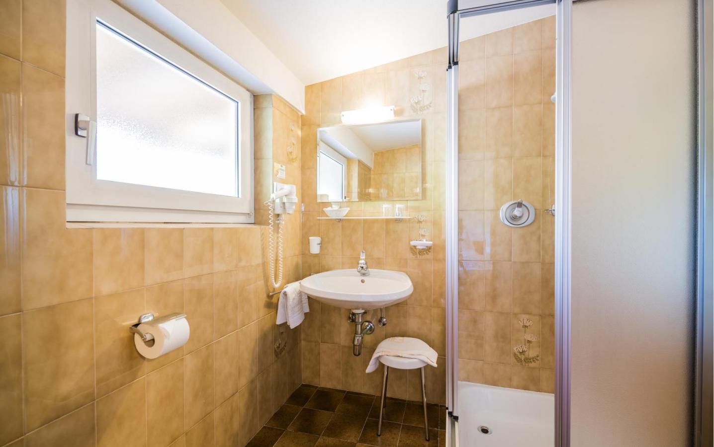 A double room at Hotel Waldheim – the adjoining bathroom