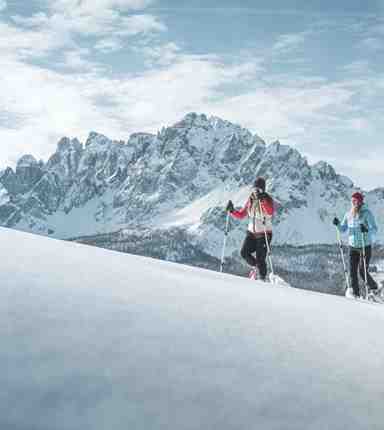 Two women snowshoeing