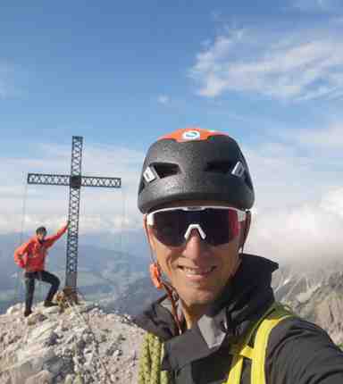 Two men on a mountain summit